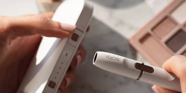 iqos 2.4 plus hands wooden desk