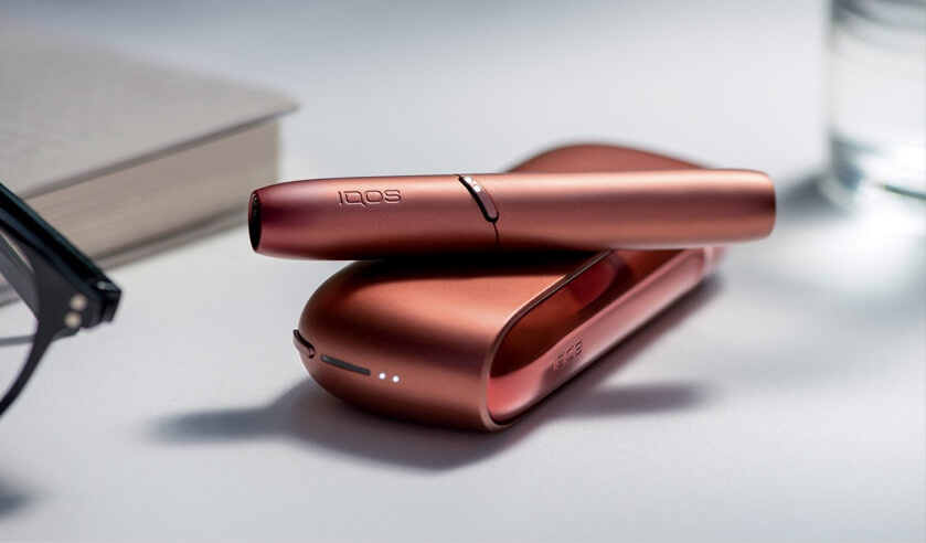 Red IQOS 3 DUO on table