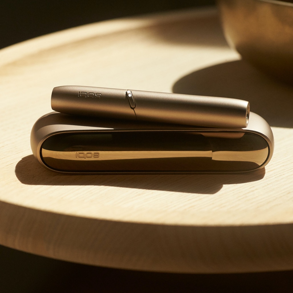 Golden Iqos device on a table